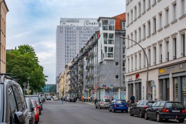 Berlin Germany July 26, 2024. Street and houses of Berlin, the Charite hospital building is visible in the background. View of Berlin. clipart