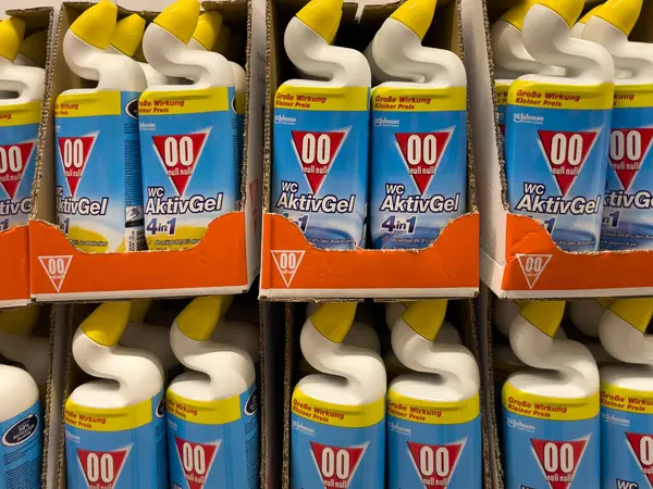 stock image A row of blue and yellow Activ Gel bottles. The product is a cleaning solution.