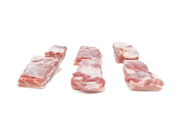 stock image A close up of a slab of meat with a white background. The meat is cut into six pieces Pork meat isolated on a white background.