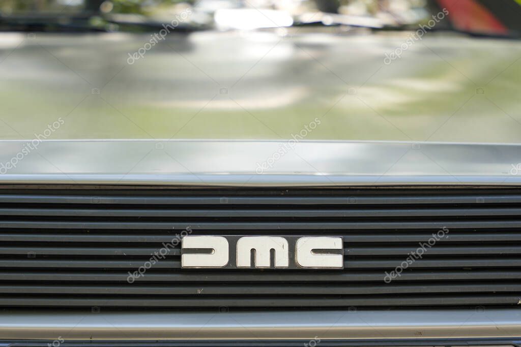Germany Berlin May 11, 2025. DMC logo front view. Close-up of the DMC logo on a stainless steel DeLorean grille. A timeless symbol from 80s automotive and pop culture history.