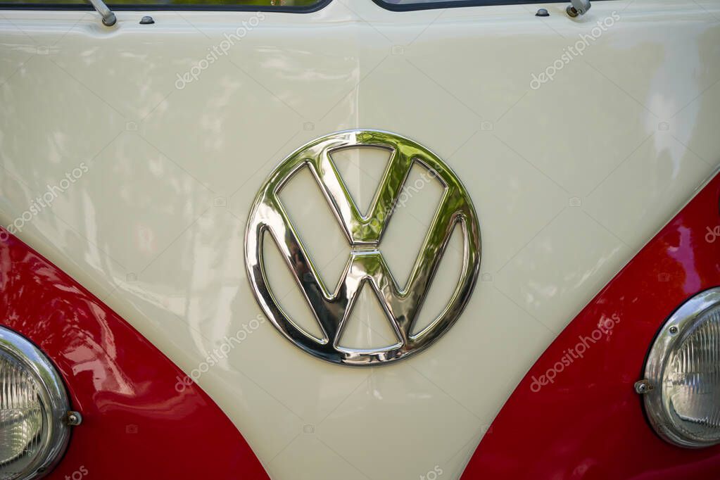 Germany Berlin May 11, 2025. VW Bulli Front Front View. The iconic front of a red and white VW Bulli with a chrome-plated VW emblem. A symbol of wanderlust and freedom that has achieved cult status worldwide.