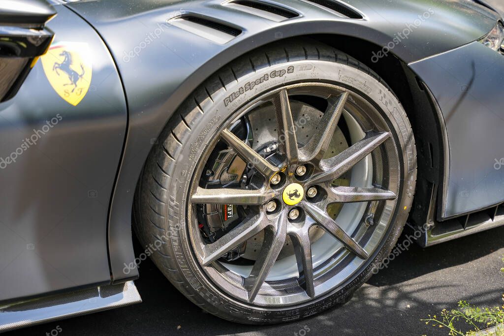 Germany Berlin May 11, 2025. Ferrari rim close-up. Detailed view of a modern Ferrari rim with a carbon structure and brake discs. The yellow hub cap and Pirelli tread complete the sporty design.