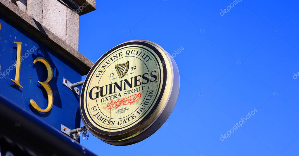 GALWAY REPUBLIC OF IRLAND 05 29 2023: Sign of Guinness is an Irish dry stout that originated in the brewery of Arthur Guinness at St. James's Gate, Dublin, Ireland, in 1759