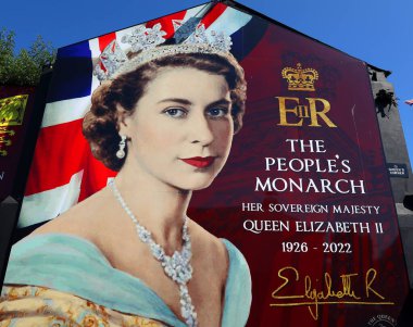 BELFAST NORTHEN IRELAND UNITED KINGDOM 06 03 2023: Belfast's Shankill Road with a giant sign to honour and remember the Queen after her dead 8 September 2022