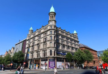 BELFAST NORTHERN IRELAND UNITED KINGDOM 06 03 2023: Green copper ogee dome and tower clock on old Robinson and Cleavers department store in belfast 