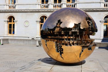 DUBLIN REPUBLIC OF IRELAND 05 28 2023: On the podium of the iconic brutalist Berkeley Library is Sfera con sfera ('Sphere within sphere'). Properly part of Trinity College Dublin's Art collection