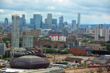 LONDON UNITED KINGDOM 06 20 2023: ABBA Voyage is taking residence in the East London venue ABBA Arena bringing back to life the beloved pop band across generations and business center in background