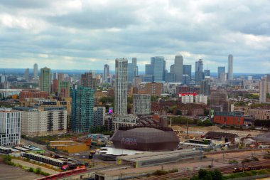 LONDON UNITED KINGDOM 06 20 2023: ABBA Voyage is taking residence in the East London venue ABBA Arena bringing back to life the beloved pop band across generations and business center in background