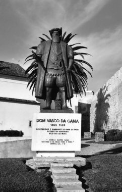 SINES PORTUGAL 10 12 2002: Statue of the legendary Portuguese explorer Vasco da Gama in front of the parish church in Sines clipart