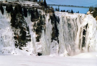 In winter the Montmorency Falls (French: Chute Montmorency) is a large waterfall on the Montmorency River in Quebec, Canada. Cold weather conditions make this area popular with climbers and hikers clipart