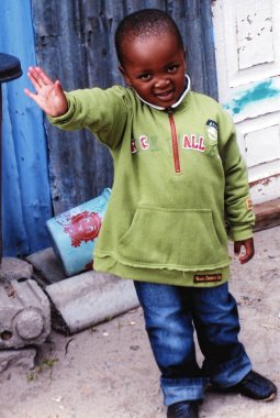 KHAYELITSHA, CAPE TOWN SOUTH AFRICA 05 22 2007: young children on a street of Khayelitsha township in Western Cape reputed to be the largest and fastest growing in SA. clipart