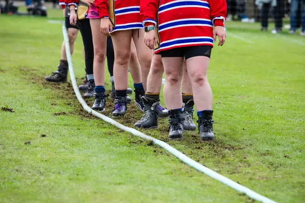 A team takes part in the tug-of-war at the Scottish Highland Games in the town of Crieff, Scotland