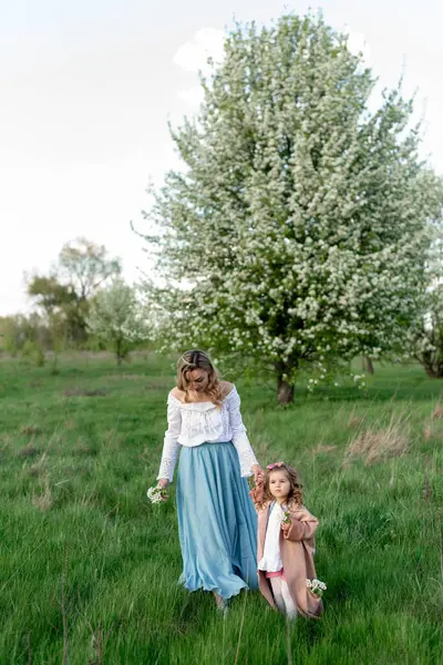Mother Little Daughter Walk Green Meadow Blooming Pear Tree Stock Image