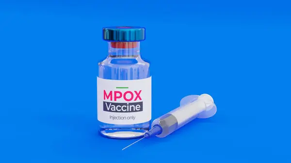 Mpox (Maymun Çiçeği) aşısı mavi arka planda izole edilmiş şırınga. Küresel salgını önlemek için virüs enfeksiyonuna karşı bağışıklık kazanmak amacıyla sadece aşı için ilaç enjekte ediliyor..