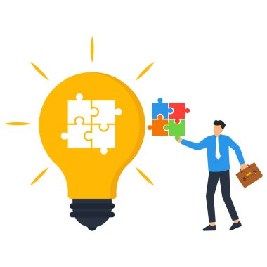 Yapboz ile ampulü bitiriyorum. İş yaratıcılığı. İlhamın sembolü, yaratıcı düşünce.