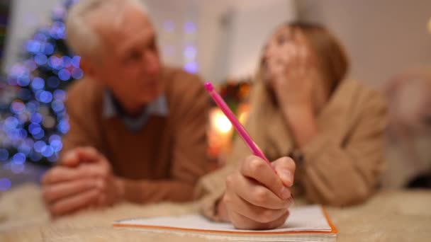 Close Teen Female Hand Writing Letter Santa Blurred Senior Man — Stock Video