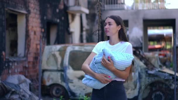 Portrait Young Ukrainian Mother Walking Baby Wrap Blanket Bombed City — Stock Video