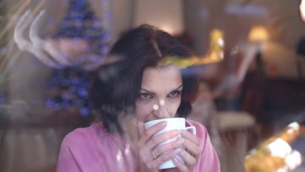 Thoughtful Gorgeous Woman Drinking Tea Christmas Eve Home Looking Out — Stock Video