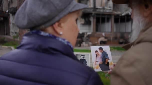 Shooting Shoulder Blurred Senior Man Woman Talking Looking Old Pictures — Stok Video
