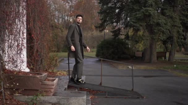 Side View Elegant Handsome Man Walking Downstairs Autumn Park Adjusting — Stock Video