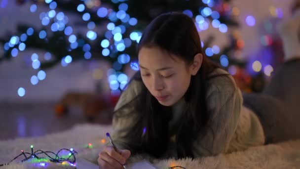 Thoughtful Attractive Slim Asian Woman Teeth Braces Writing Letter Santa — Stock Video