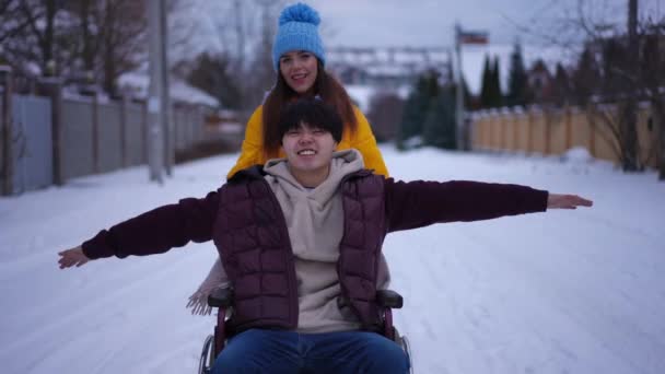Joyful Asian Man Stretching Hands Sitting Wheelchair Smiling Caucasian Woman — Stock Video