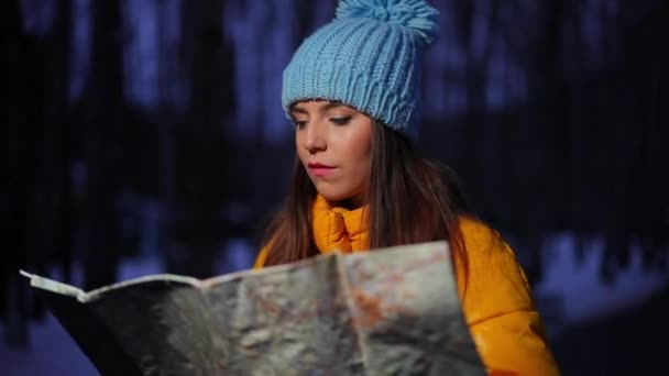 Young Thoughtful Woman Examining Map Looking Camera Smiling Standing Winter — Stock Video