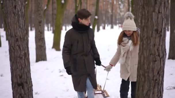 Beautiful Teen Girl Handsome Boy Walking Trees Winter Forest Pulling — Stock Video