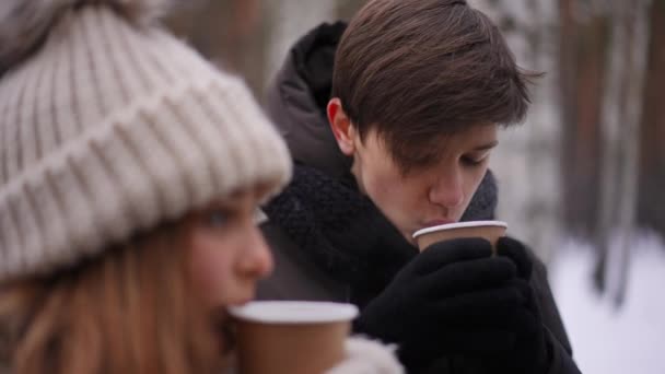 Teenage Caucasian Boy Drinking Hot Tea Standing Girl Winter Park — Stock Video