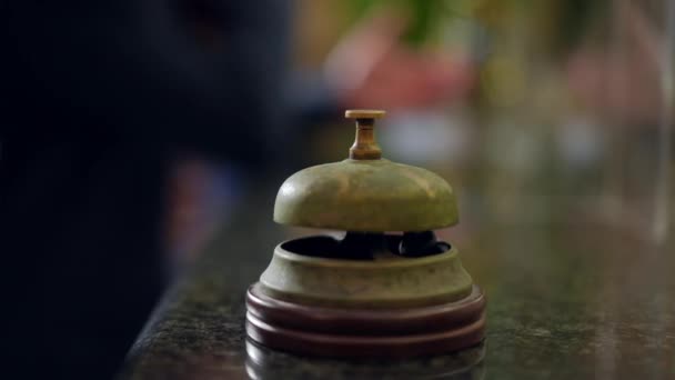 Close Female Hand Pressing Old Fashioned Hotel Bell Reception Desk — 비디오