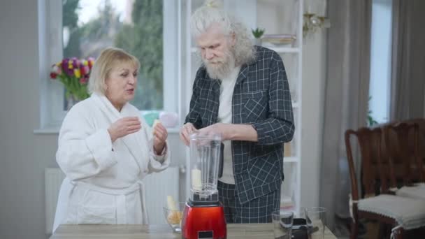 Positive Confident Happy Senior Couple Cooking Healthful Smoothie Slow Motion — Video