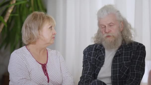 Serious Senior Couple Talking Slow Motion Looking Camera Caucasian Husband — Video