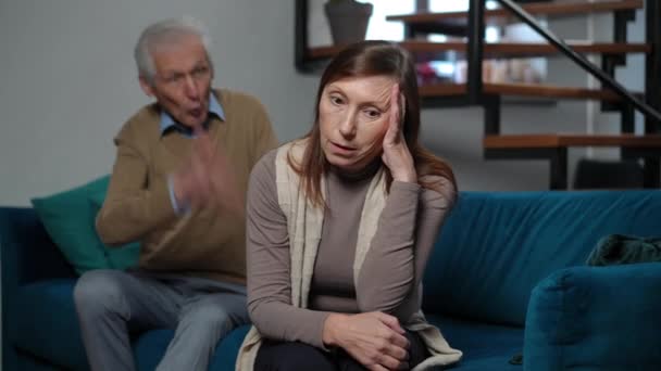 Rack Focus Annoyed Senior Wife Rolling Eyes Arguing Husband Standing — Stock Video