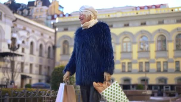 Smiling Gorgeous Senior Woman Strolling City Shopping Bags Looking Portrait — Stock video