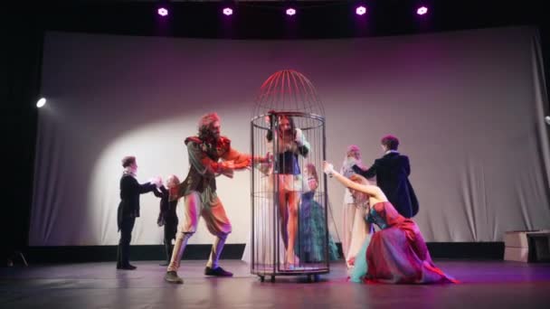 Wide Shot Theatrical Performance Evil Characters Spinning Cage Woman Careless — Stock video