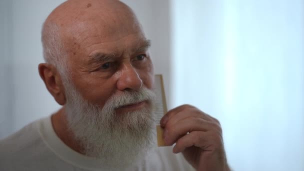 Close Reflection Mirror Senior Bearded Caucasian Man Combing Hair Smiling — Video