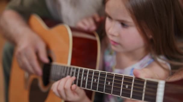 Guitar Fretboard Blurred Focused Girl Learning Playing String Instrument Unrecognizable — Stock Video