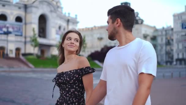 Tracking Shot Smiling Satisfied Beautiful Young Girlfriend Strolling Handsome Boyfriend — Stockvideo