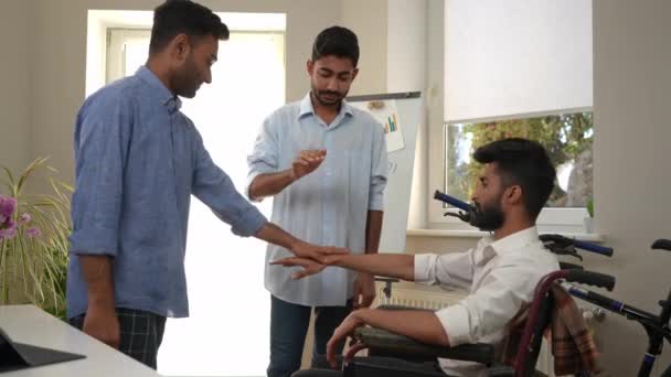 Joyful Middle Eastern Male Friends Stacking Hands Rejoicing Startup Idea — Stock video