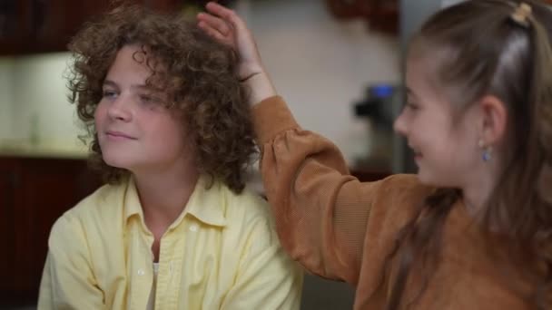 Relaxed Caucasian Boy Smiling Blurred Girl Caressing Curly Hair Hand — Video Stock