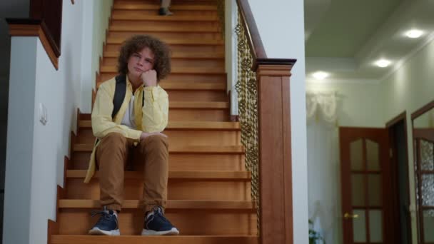 Portrait Bored Caucasian Boy Sitting Stairs Home Waiting Girl Walking — 图库视频影像