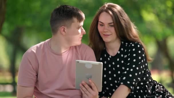 Joyful Young Couple Talking Smiling Surfing Internet Digital Tablet App — Wideo stockowe
