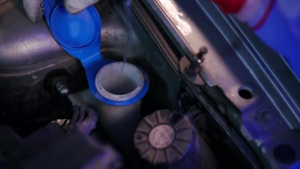 Close Pouring Nonfreezing Liquid Car Hood Unrecognizable Young Man Uniform — стоковое видео