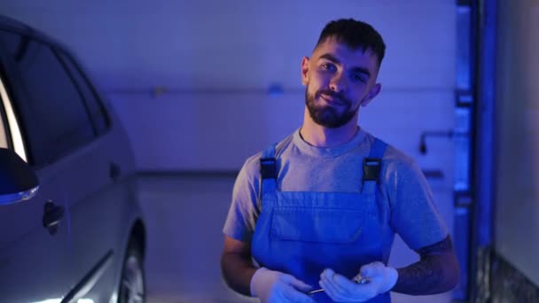 Medium Shot Portrait Smiling Auto Mechanic Posing Garage Car Wrench — стоковое видео