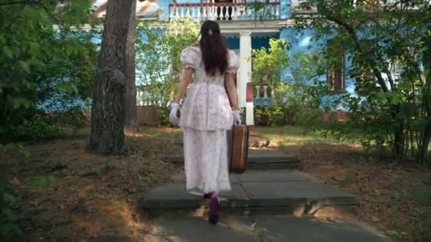 Tracking Shot Slim Elegant Lady Vintage Dress Walking Suitcase Alley — Vídeos de Stock