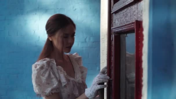 Young Woman Retro Dress Entering Porch Touching Vintage Door Looking — Stockvideo