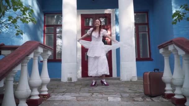Elegant Happy Young Woman Retro Outfit Spinning Porch Smiling Wide — Stockvideo