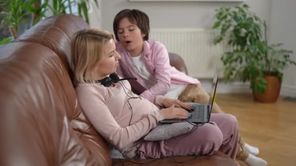 Concentrated Pregnant Mother Working Online Misbehaving Son Distracting Freelancer Side — Stock Video