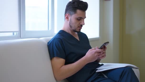 Side Angle View Young Handsome Doctor Messaging Online Smartphone App — Stock Video