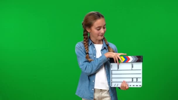 Joyful Caucasian Teen Girl Posing Film Clapperboard Green Screen Background — Stock Video